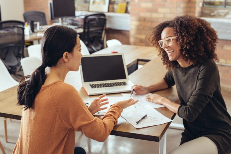 2021 03 12 Two women discussing paperwork 1300w GettyImages 638953230